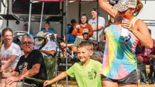 Heidi and Hunter Holliman celebrate placing at the Taylor International Barbecue Cookoff in Taylor Aug. 20. Photos by Fernando Castro