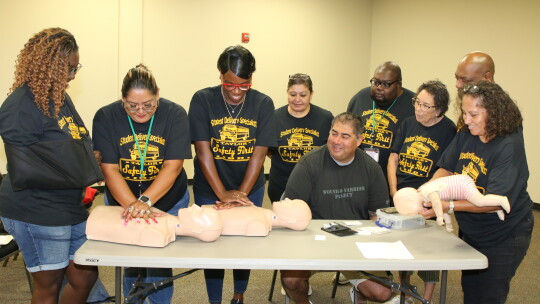 Taylor ISD bus drivers, bus monitors and crossing guards concentrate on their annual CPR training. At the training were (from left) LaShondra Corley, Joanna Moreno, Manayah Miller, Juana Avalos, Calvin Shaw, Felix Martinez, Bryan Coleman, Luz Gonzales and instructor Jimmy Casares.