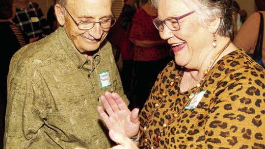 Chester Martin (class of 1961) and Jean Johnson (class of 1962) share a laugh