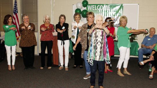 Carolyn “Tutta” Jackson (Class of 1944) leads former cheerleaders in a cheer at Homecoming 2019. Mrs. Jackson plans to attend homecoming 2022 to continue the cheerleading tradition. Photo by Tim Crow