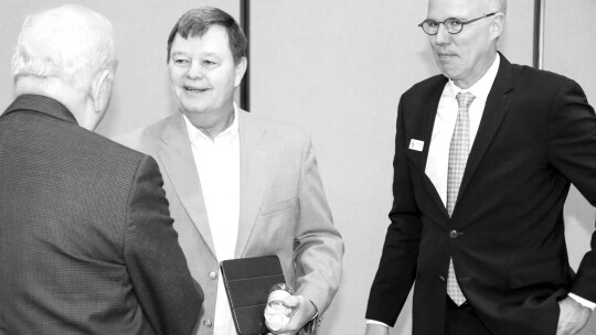 Ed Komandosky (left) greets Gary Westbrook of Post Oak Savannah GCD and Mayor Brandt Rydell during the pre-legislative summit last week. Photo by Jason Hennington