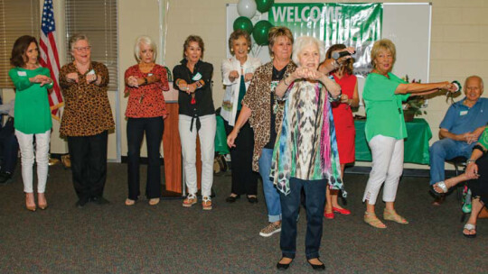 Carolyn “Tutta” Jackson (Class of 1944) leads former cheerleaders in a cheer at Homecoming 2019. Mrs. Jackson plans to attend homecoming 2022 to continue the cheerleading tradition. Photo by Tim Crow