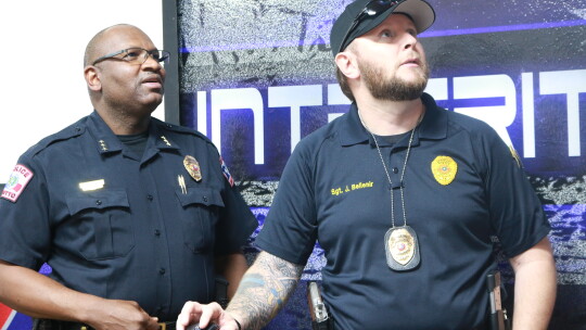 Chief Jeffrey Yarbrough and Sergeant Josh Bellenir view a training presentation for the Civilian Response to Active Shooter Events (CRASE) training.