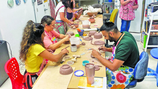 Volunteers making soup bowls. Courtesy photo