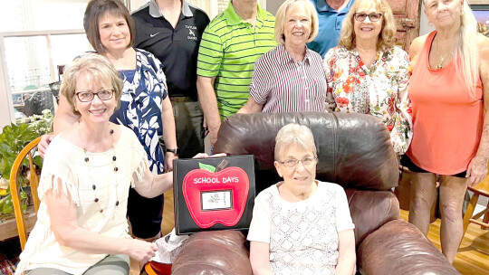 Members of the class of 1971 reunite with a former teacher, Lois Luedtke (sitting), during homecoming week. At the reunion were (from left) Suzanne Thoele, Amy Allgood, John McDonald, Kenny Cmerek, Moppy Miller, Tim Kennedy, Wanda Williams, Kathy Braun. Photos courtesy of Suzanne Thoele