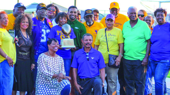 As a tribute to the 1962 O.L. Price High School state championship team, the Taylor Ducks wore purple and gold, Price’s high school colors, during pregame activities. Photo by Catherine McGary