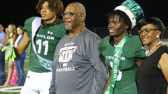 T.L. Garner (middle) is living his dream of watching his sons Treos Richardson (left) and Jarvis Anderson play together on the Taylor Duck football team. Photo by Jason Hennington