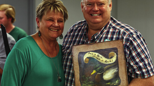 Tim Crow (right) is now a member of the Duck Hall of Fame. He was congratulated by Pat Helbert.