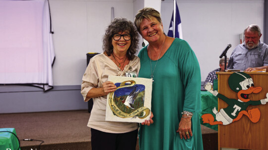 Jessica Harkins Shahin (left) was inducted to the Duck Hall of Fame by Pat Helbert during homecoming weekend.