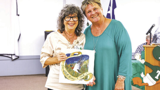 Jessica Harkins Shahin (left) was inducted to the Duck Hall of Fame by Pat Helbert during homecoming weekend. Photo by Ryan Newsome