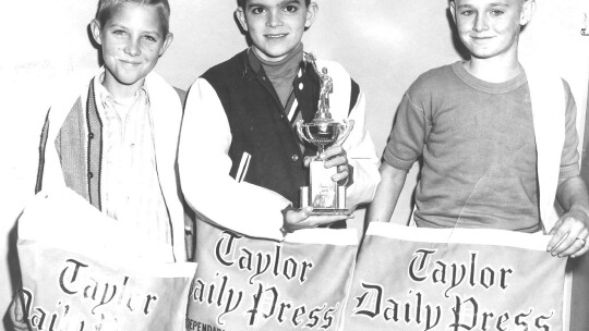 Jack Tinsley (center) is recognized as the Carrier of the Year in the mid 1960s. Mark Weber (left) and Randy Bohls were runners up.