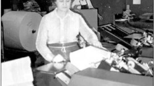 A long time Press employee. Dorothy Cuba worked in the pressroom and also delivered papers. Here she is in the Pressroom getting the papers ready to go out to the carriers, post office and racks.