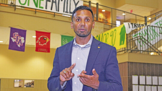 Dr. Devin Padavil explains the effect of the proposed $82.47 million bond on the Taylor ISD tax rate at a community meeting at Taylor High School. Photos by Edie Zuvanich