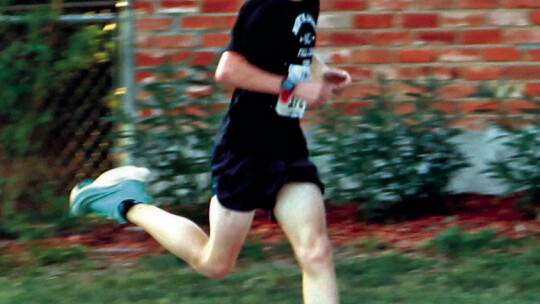 Kingston Wilson, 13, just before he crosses the finish line to win first place Oct. 8 for the Good Life Taylor 5K at Bull Branch Park. Photos by Nicole Lessin