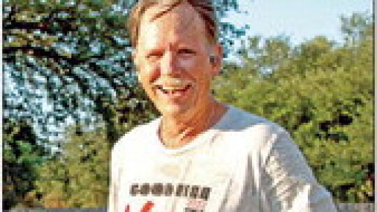 District 2 Councilman Mitchell Drummond takes a water break after running the Good Life Taylor 5K.