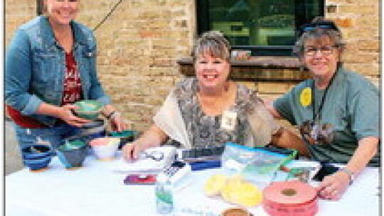 (From left) Michelle Leal poses with Shepherd’s Heart volunteers JoLynne Williams and Cheryl Conrnelius Oct. 8 at the Empty Bowl FUNdraiser. Photos by Catherine Mcgary