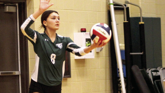 Makenna Watson serves the ball during against Manor New Tech. Photos by Evan Hale