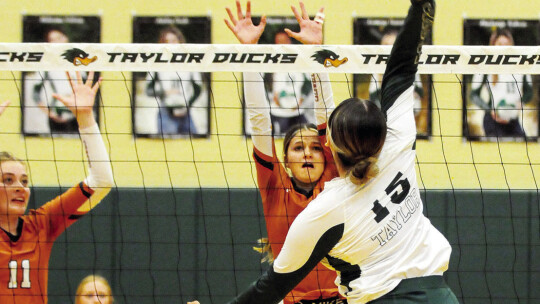 Mackenzie Watson spikes the ball during game against Caldwell.