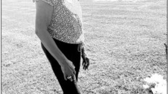 Leslie Hill shows the gravesite of her mother, Otis Mae Washington, at the cemetery.