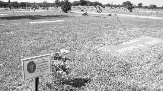 Flowers and a placard at the city of Taylor cemetery decorate the gravesite of Denise Richter, who died unexpectedly in February.