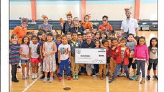 Students in Charles Powitsky’s class celebrate with their teacher as he is awarded a $5,000 grant by the Hutto Education Foundation. Photos courtesy of the Hutto ISD Facebook page