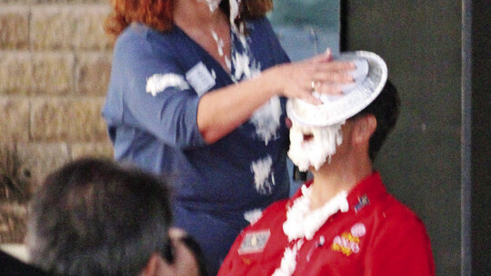 Organizer Tia Rae Stone puts a pie in the face of Rotary District 5870 Central Texas’s Scott Rainey as District 4 Councilman Robert Garcia looks on to raise funds to fight polio Oct. 20 at Heritage Square Park.