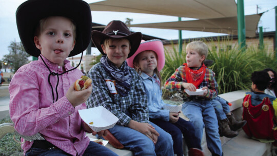 (From left) Ezra Ripple, 6, eats a hot dog alongside siblings Gideon Ripple, 8, Evangeline Ripple 5, and Luke Ripple, 6.