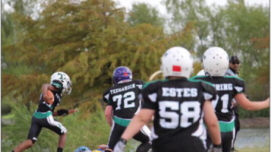 The Taylor Youth Ducks run in a touchdown during their semi-final game against Rockdale. Photo by Vershiba Cook