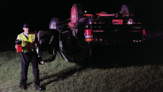 Emergency personnel at the scene of an overturned vehicle flipped Sept. 12 near the intersection of C.R. 366 and Carlos G. Parker Boulevard Northwest. Photo by Nicole Lessin