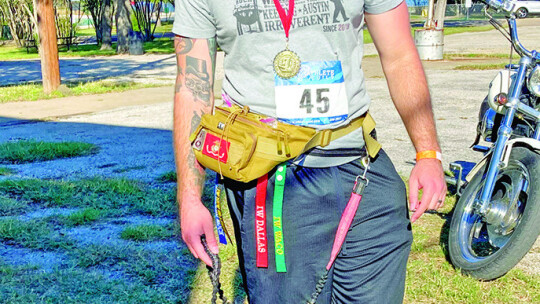 First place finisher in the 21-30 year old age category Jace Gilbreath relaxes after the fifth annual beer run Nov. 5.