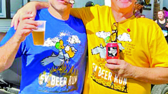 Race organizer Scott Dean enjoys a cold beer with Steve Smith Nov. 5 by the American Legion Graham D. Luhn Post 39 in Taylor. Facebook/TexasBeerCompany