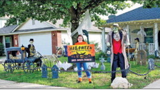 Tracie Rogers (shown) and mom Janet Pomeroy spent a whole month decorating their home at 134 Brooke St. and screamed away with one of the Judge’s Choice awards. Photos by Edie Zuvanich.