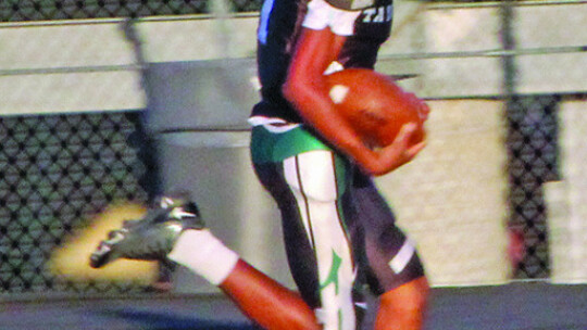 Youth Ducks quarterback Jeremiah Caldwell breaking free for a touchdown run.