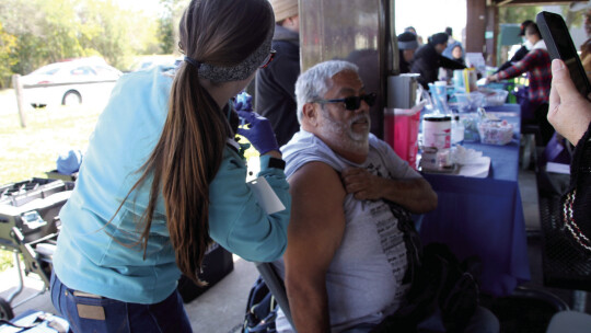 Jose Orta receives a free flu shot Nov. 12 at the Fannie Robison Park Pavilion. Orta was one of many people who attended to hear health tips and get flu shots. Photos by Nicole Lessin