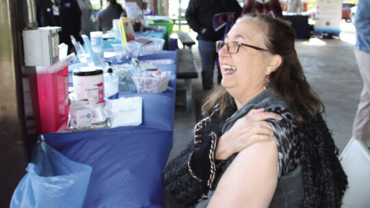 Barbara Yerby receives a free “birthday” flu shot at the health fair Nov. 12. Photo by Nicole Lessin