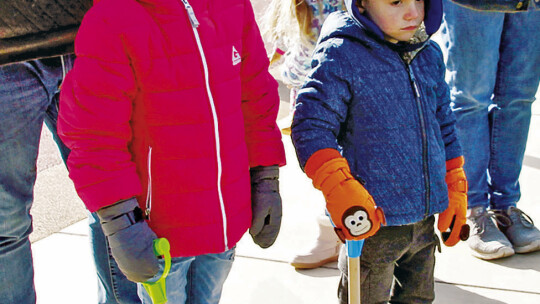 Helpers Riley Poll, 5, waits to dig with brother Ben Poll, 4, Nov. 12 for the annual Arbor Day tree planting celebration at Heritage Square. Photo by Nicole Lessin