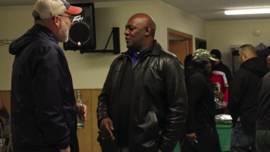 Mayor Brandt Rydell speaks with Pastor Johnny Spence Nov. 19 before the deliveries start.