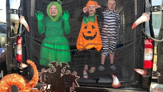 The Niepert girls in their decorated SUV. Pretty scary! Photo by Susan Garry