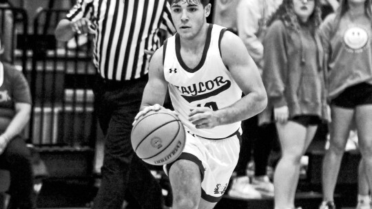 Ducks’ senior Ryan Valdez dribbling the ball to an open lane to try and get past the defender. Photo by Larry Pelchat