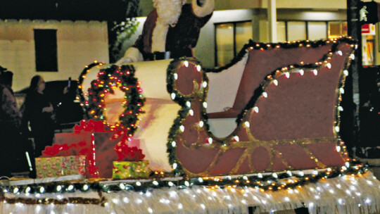 Santa rides by in his sleigh during Taylor Area Ministerial Alliance’s Christmas Parade of Lights Dec. 3. Photos by Nicole Lessin