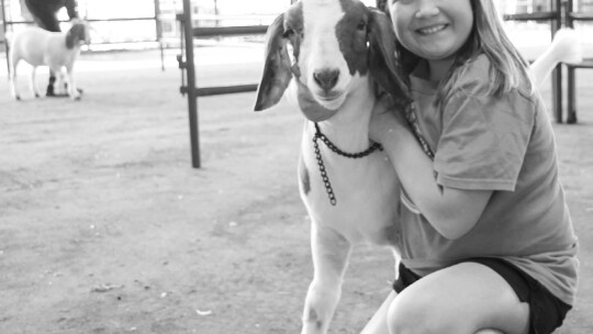 McKenzie Nunez, 9, from Hutto, poses with her goat Dec. 5.