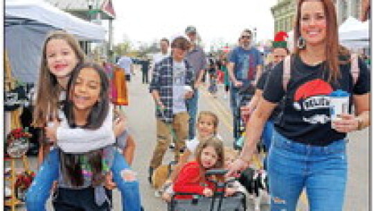 Harper Gamboa gives Lilly Ana-Marie a ride while mom Maggie Soto tows Haddie, Holt and Charly behind.