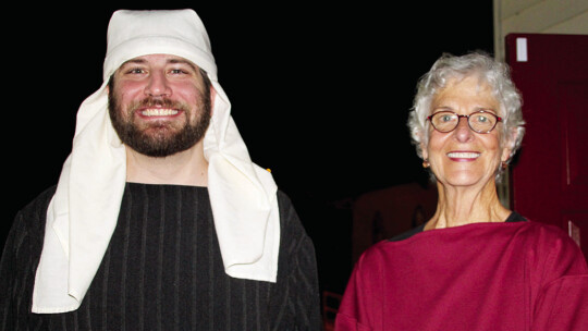 Pastor Caleb Bahr stands with Phyllis Johnson at the conclusion of “The Pilgrimage to Bethlehem: A Live Nativity” Dec. 11 at Immanuel Lutheran Church.