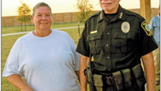 Taylor Police Communications Supervisor Theresa Briones visits with Chief Henry Fluck Oct. 4 at the Avery Glenn subdivision’s block party. Photos by Nicole Lessin