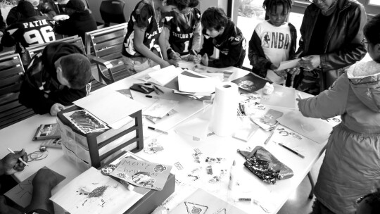 Taylor Youth Ducks, who recently won the Tri-County Youth Football League Super Bowl, make Christmas cards and ornaments for seniors in cooperation with Life Steps Council on Alcohol and Drugs, which organized the event. Photo by Nicole Lessin