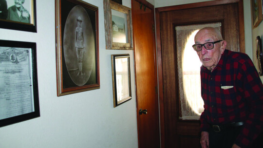 Above: Moczygemba shows a photo of his dad, a veteran of World War I.