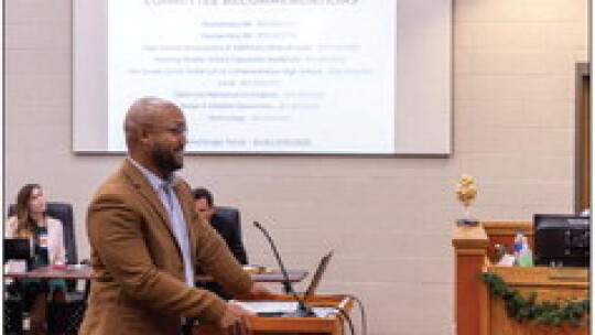 Planning committee member Brian Thompson in front of a slide outlining the bond recommendations. Photos courtesy of Hutto ISD