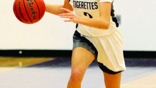 Tigerettes freshman Brynn Leschber dribbling the ball up the court on a fast break. Photo by Larry Pelchat