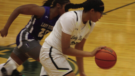 Lady Ducks sophomore Kionayh Rivers steals the ball and heads up the court on a fast break.