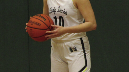 Lady Ducks junior Ansley Reed checking the ball into play. Photo by Evan Hale